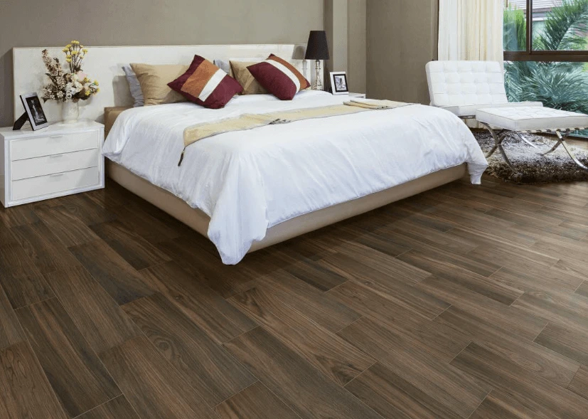 Walnut-toned hardwood flooring in a quiet bedroom