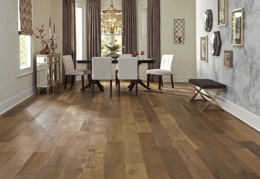 Satin-finished hardwood floor under a formal dining table