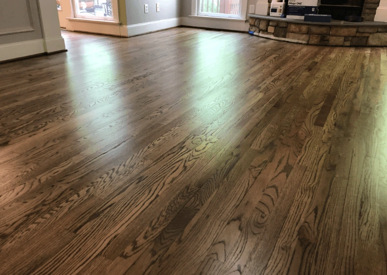 Sanded oak floor finished with a medium stain in a Broken Arrow living room